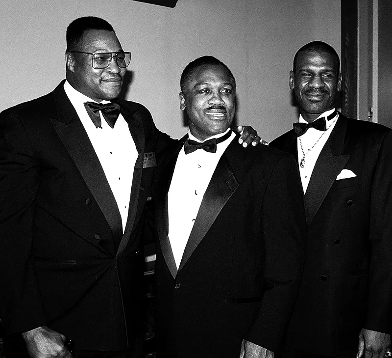 Larry Holmes, Joe Frazier and Michael Spinks posing for the camera